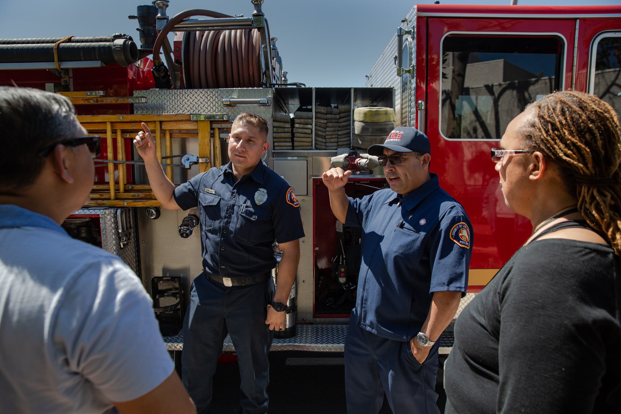 Los Angeles County firefighter Salvador Mejia (left) and Luis Gonzales, a Community Emergency Response Team instructor with the fire department, train members of the public on how to help their neighbors before first responders arrive on the scene.(Brigette Waltermire/News21)
